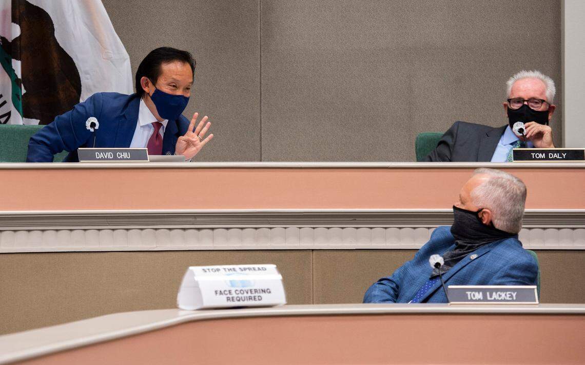 Assemblyman David Chiu, D-San Francisco, signals to Assemblyman Tom Lackey, R-Palmdale, while listening to Employment Development Department Director Sharon Hilliard, who appeared remotely, during a budget subcommittee oversight hearing at the Capitol in Sacramento on Thursday, July 30, 2020.