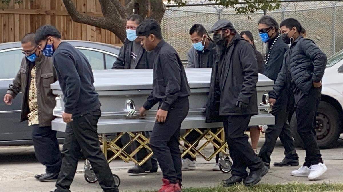 Marshallese residents carry out a funeral procession in Sacramento in 2020. The COVID-19 fatality rate among Native Hawaiians and Pacific Islanders is nearly twice as high as the county average.