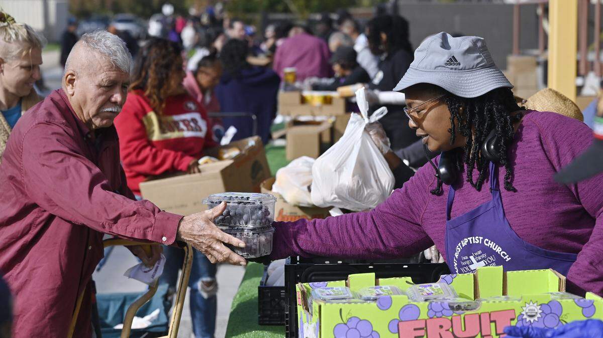 Food provided by the Central California Food Bank is distributed at Saint Rest Baptist Church Thursday, Nov. 6, 2025 in West Fresno, as federal benefits were limited due to an ongoing government shutdown. Cuts to this federal program will stress the safety net system. 