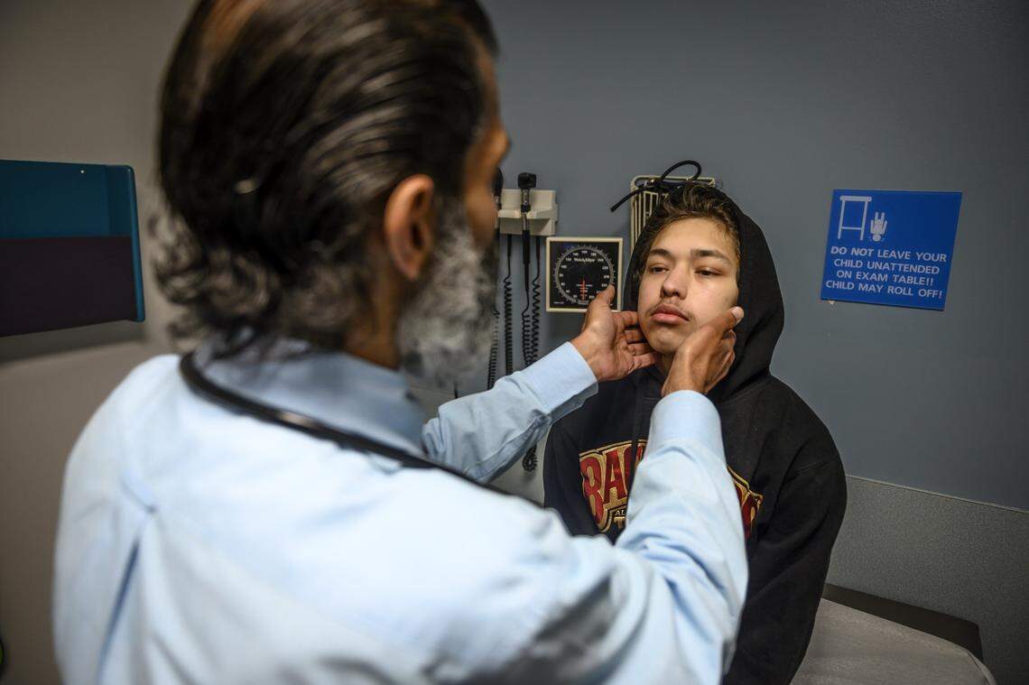 Alex Gonzalez has a post-surgery checkup Thursday, April 9, 2020, with Dr. Lavjay Butani after having a kidney transplant two weeks earlier at UC Davis Medical Center in Sacramento. Gonzalez received the kidney from a deceased donor after one donated by his mother failed. He and his family visit the hospital to get lab work done and to see how his body is accepting the new kidney.