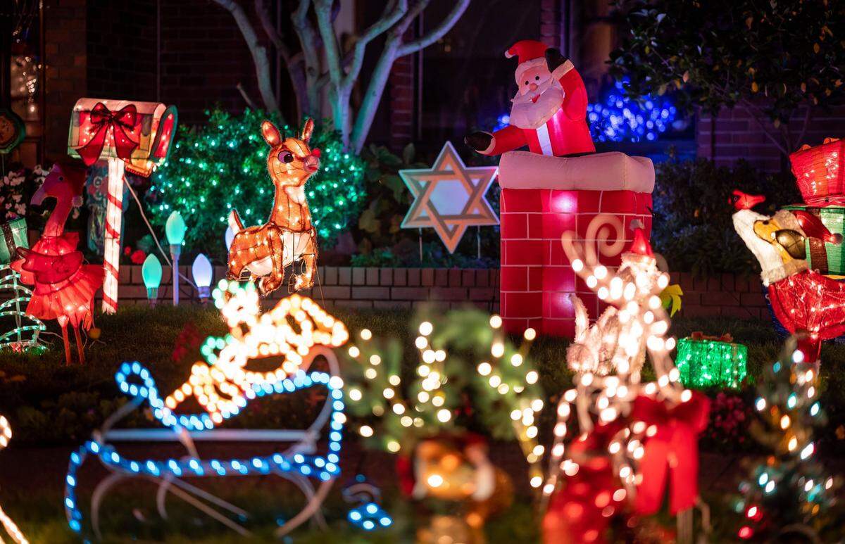 Holiday-themed lights and displays celebrating the season cover the lawn at 68 Southlite Circle in Sacramento’s Greenhaven neighborhood in December.