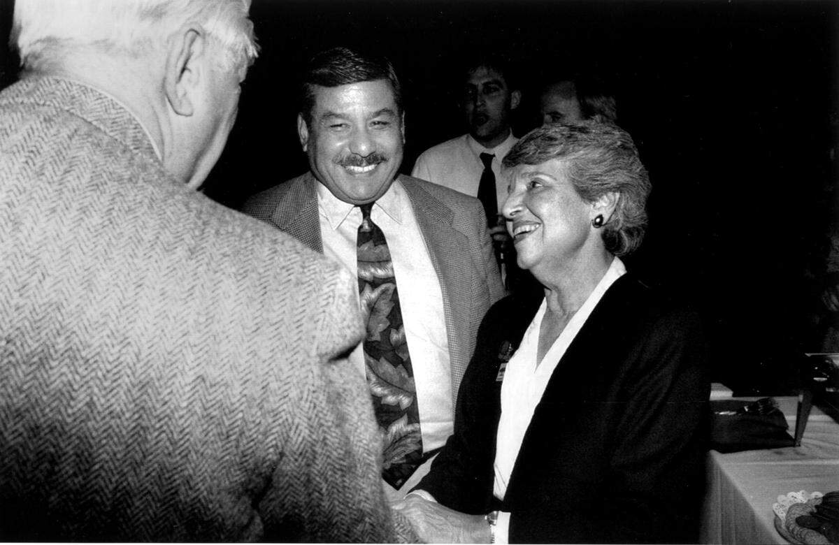 Incoming Mayor Joe Serna and outgoing Mayor Anne Rudin accept congratulations in November 1992 from a well-wisher at a gathering in the Bull Market restaurant, following the final City Council meeting for the outgoing mayor.