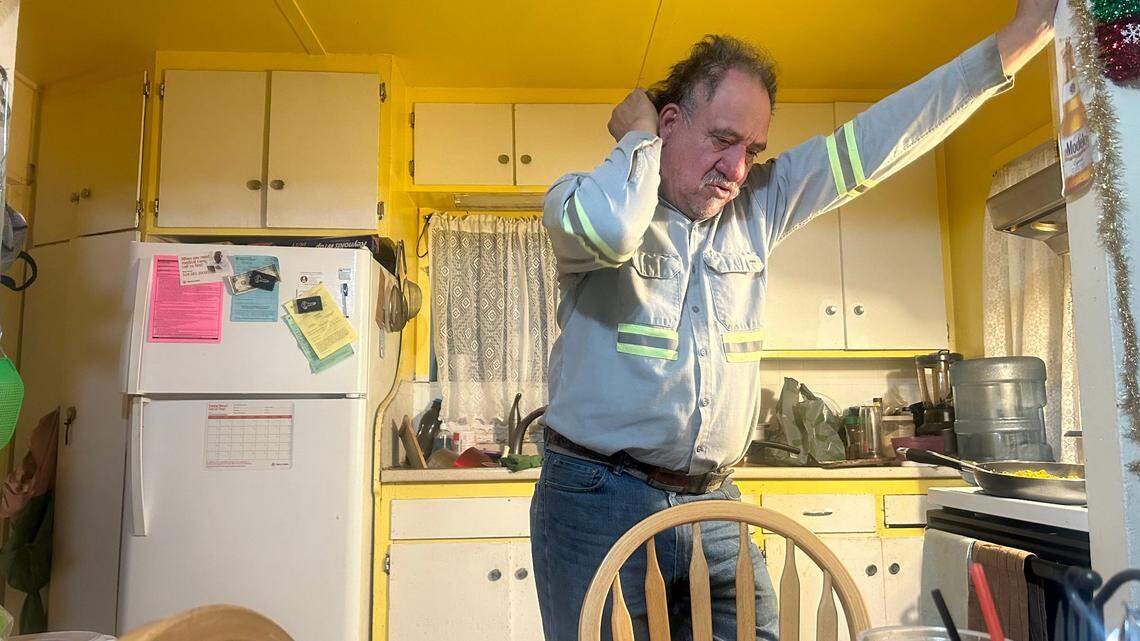 Eduardo Martinez, 57, grieves the death of his wife Margarita Martinez, who recently died of breast cancer, in November.