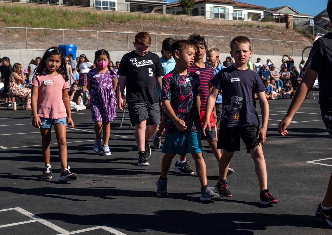 Students prepare to walk to their classrooms during the first-ever day of school at Quarry Trail Elementary School in Rocklin on Aug. 10. The school offers the district’s first dual-language instruction program but are struggling to recruit Spanish-speaking families said principal Melanie Patterson.