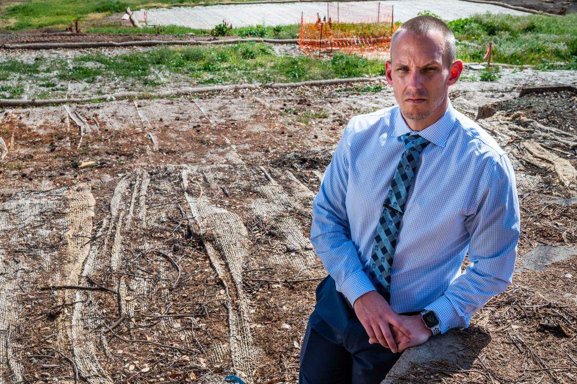 Ian MacMillan, whose home in Napa County’s Deer Park burned in September’s Glass Fire, stands on his cleared property in April. “There’s no way I’d want to leave – no way,” said MacMillan, a high school football coach.