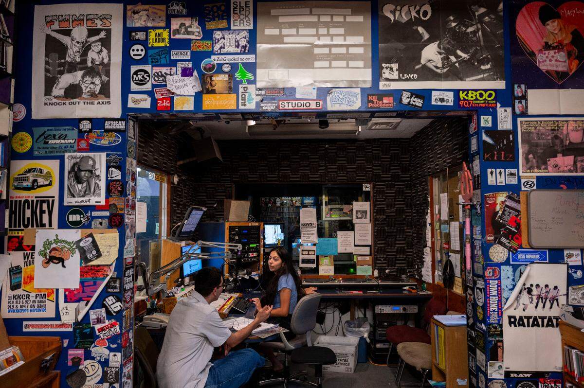 Celine Collazo, right, a KDVS radio DJ that goes by “DJ Moon” sits with Vicente Valdebenito while broadcasting her show called Insomnia at UC Davis last month.
