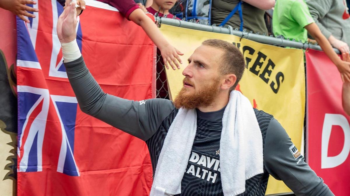 Sacramento Republic FC goalkeeper Daniel Vitiello (31) high fives fans after the USL Championship soccer match against Tulsa on Sunday, March 27, 2022, at Heart Health Park in Sacramento. Sacramento Republic FC won 2-1.