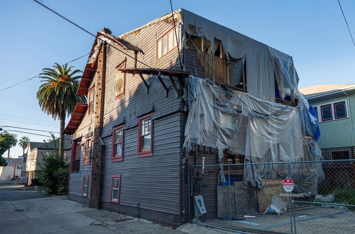 Construction efforts related to damage from a fire a few years ago are visible at a vacant home at 1315 22nd St. in midtown Sacramento on Friday. The city recent sued the owners of the property.