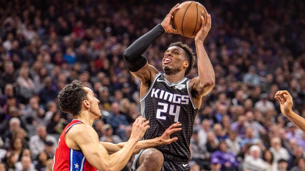 Sacramento Kings guard Buddy Hield (24) goes to the basket against the Philadelphia 76ers guard Landry Shamet (1) on Saturday, Feb. 02, 2019 at the Golden 1 Center in Sacramento.