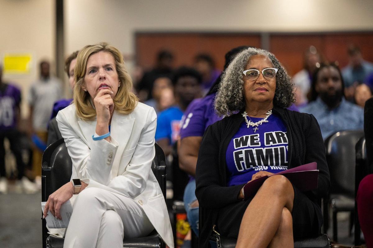 Lisa Ruda, St. Hope Public Schools Superintendent, left, and Cassandra Jennings, CEO of both St. Hope Academy and St. Hope Development Center, right, listen to speakers at the Sacramento City Unified school board board meeting on Thursday.