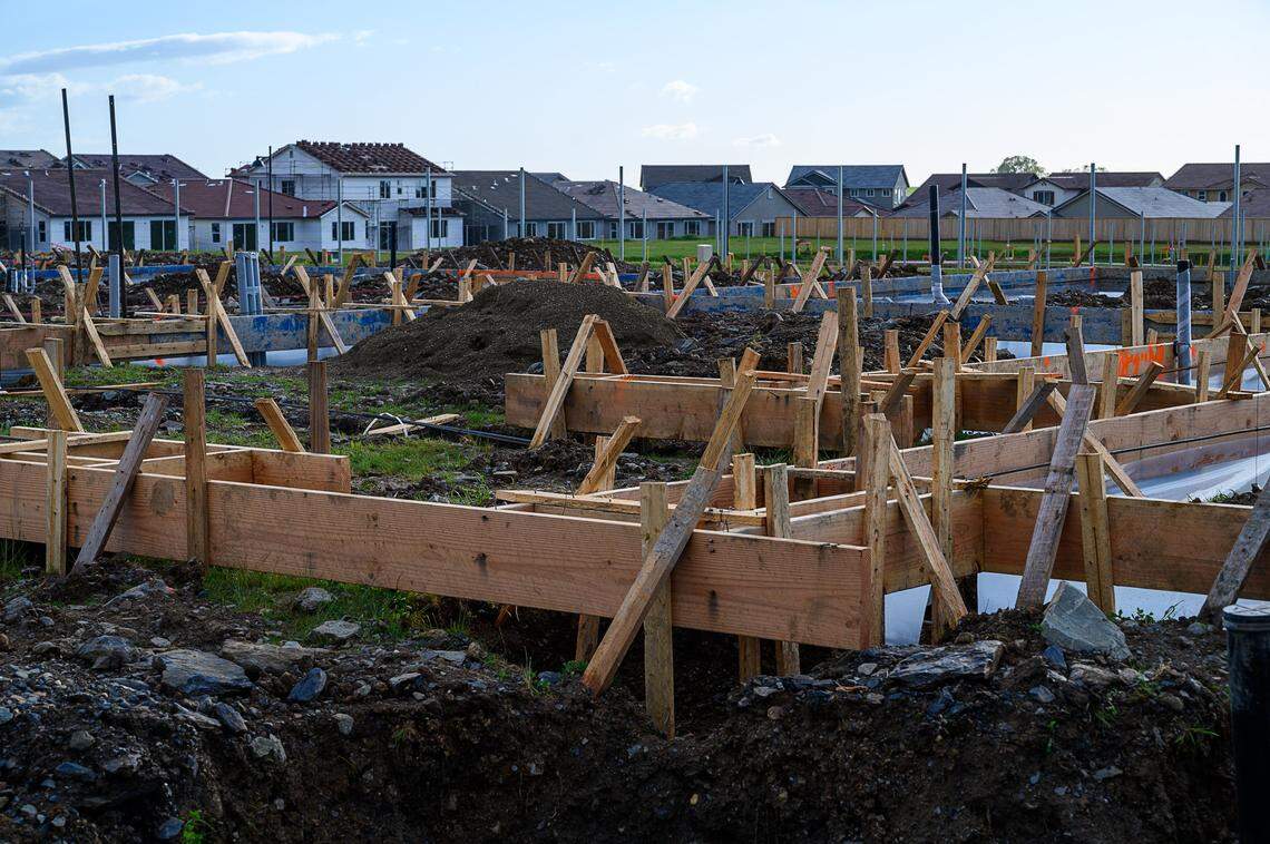 Construction is underway on new homes along Scott Road off a newly paved Mangini Parkway at Folsom Ranch, Wednesday, March 27, 2019 in Folsom.