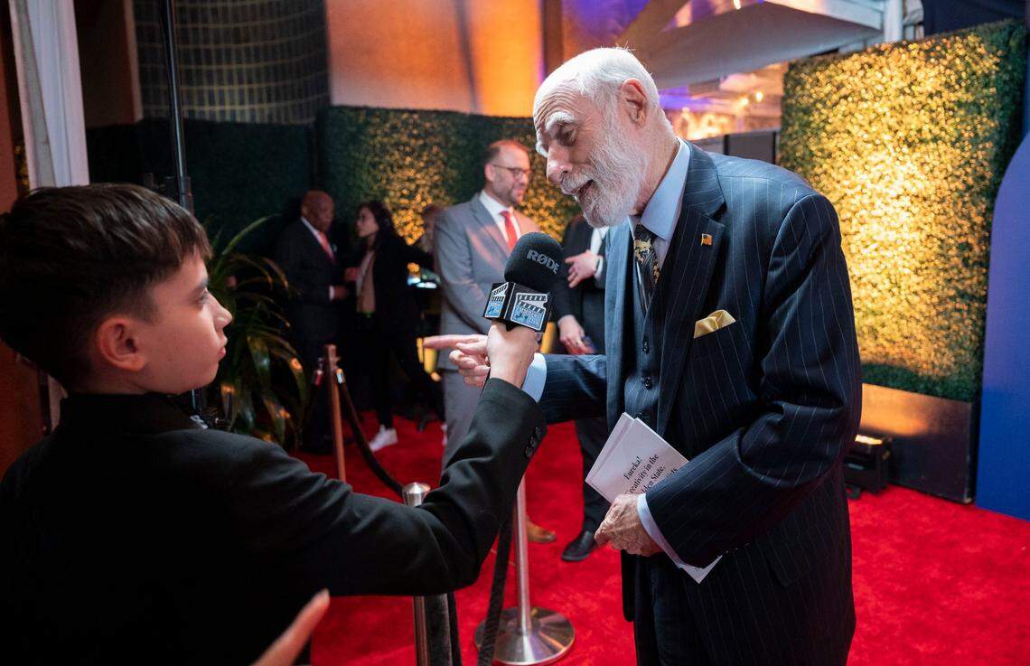 Renowned computer scientist Vinton Cerf, right, known as the Father of the internet, talks with a member of a student media team from Elk Grove on the red carpet before being inducted into the California Hall of Fame on Tuesday.