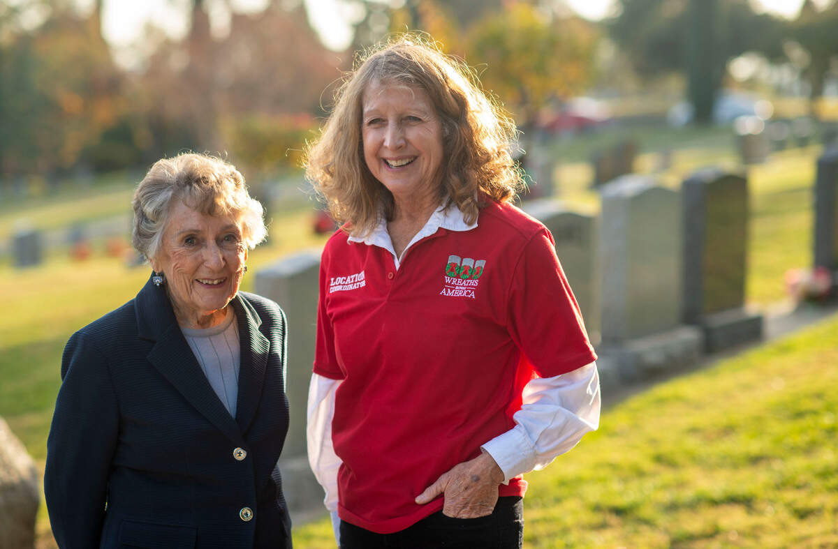 Lois Gruber, 93, left, and Joanne English stand at the Newcastle Cemetery on Wednesday. Both English’s dad and Gruber’s husband are among 1,252 veterans buried in Placer County at the Newcastle, Rocklin, Gold Hill and Ophir cemeteries and English is hoping to place wreaths on all their headstones this holiday season with the help from Book of Dreams readers.