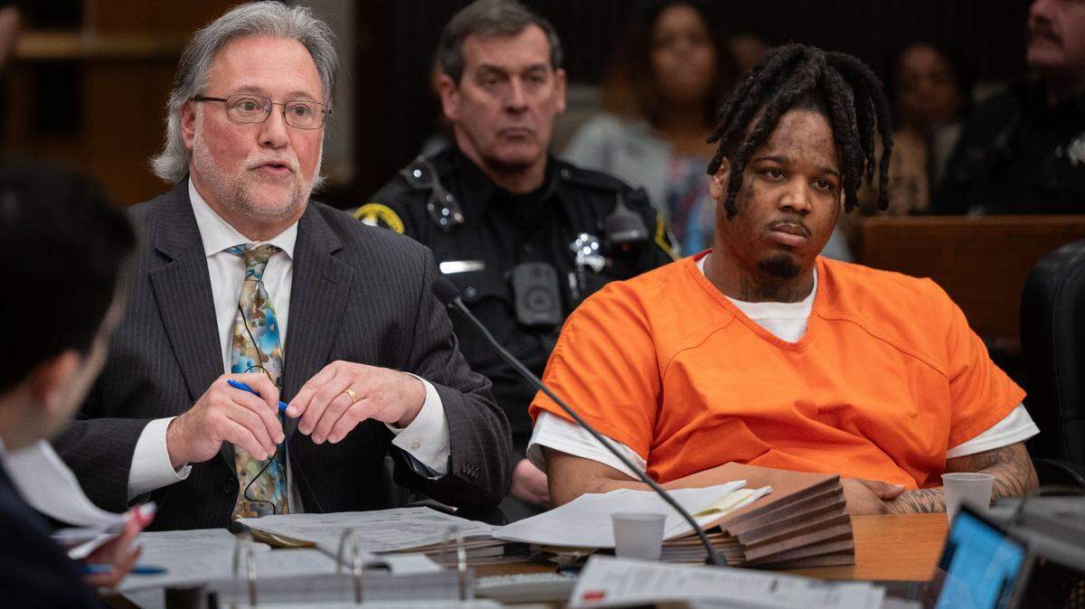 Public defender Norm Dawson questions a witness as murder suspect Smiley Martin, 23, listens on Friday, Feb. 23, 2024, during a preliminary hearing in Sacramento Superior Court for the case of the April 2022 mass shooting in downtown Sacramento.