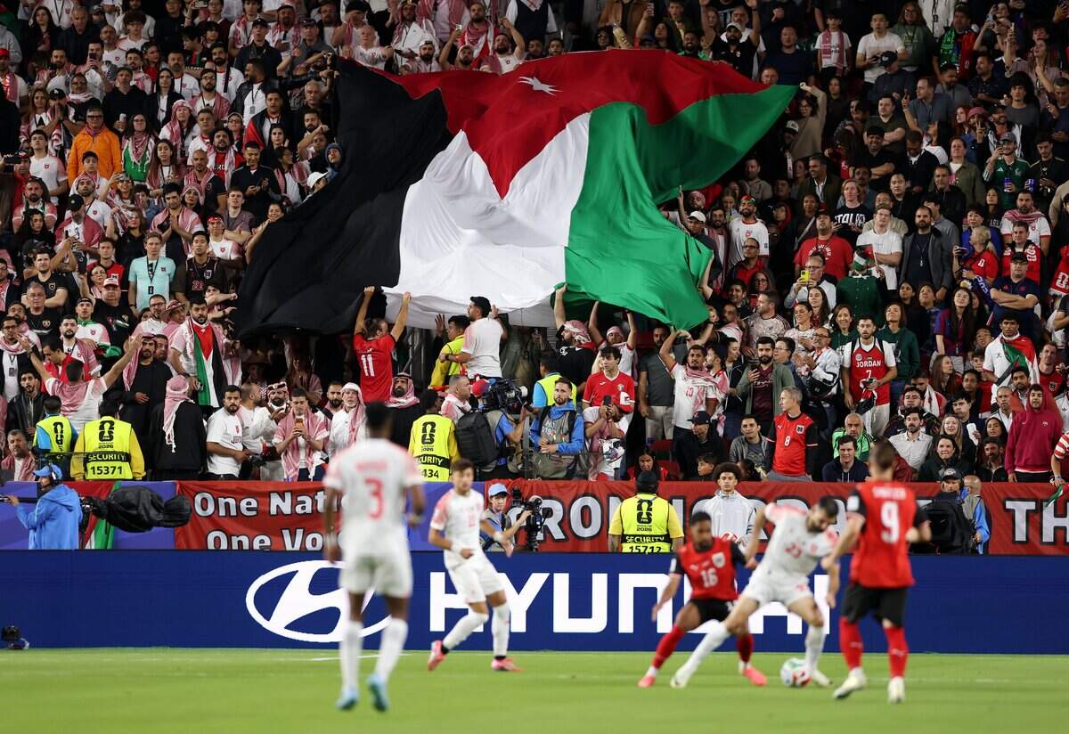 SANTA CLARA, CALIFORNIA - JUNE 16: Fans of Jordan spread the big national flag during the FIFA World Cup 2026 Group J match between Austria and Jordan at San Francisco Bay Area Stadium on June 16, 2026 in Santa Clara, California. (Photo by Stu Forster/Getty Images)