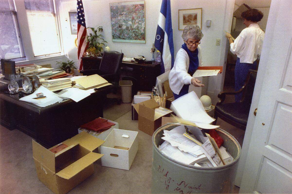 Outgoing Mayor Anne Rudin pitches papers into a discard barrel on Nov. 20, 1992, as she cleans out her office in City Hall, her nine years as mayor drawing down to the last days. Charlene Noyes of the Sacramento City Archives, in the background, assists the mayor with cataloging keepsakes, gifts and documents to be held in city archives.