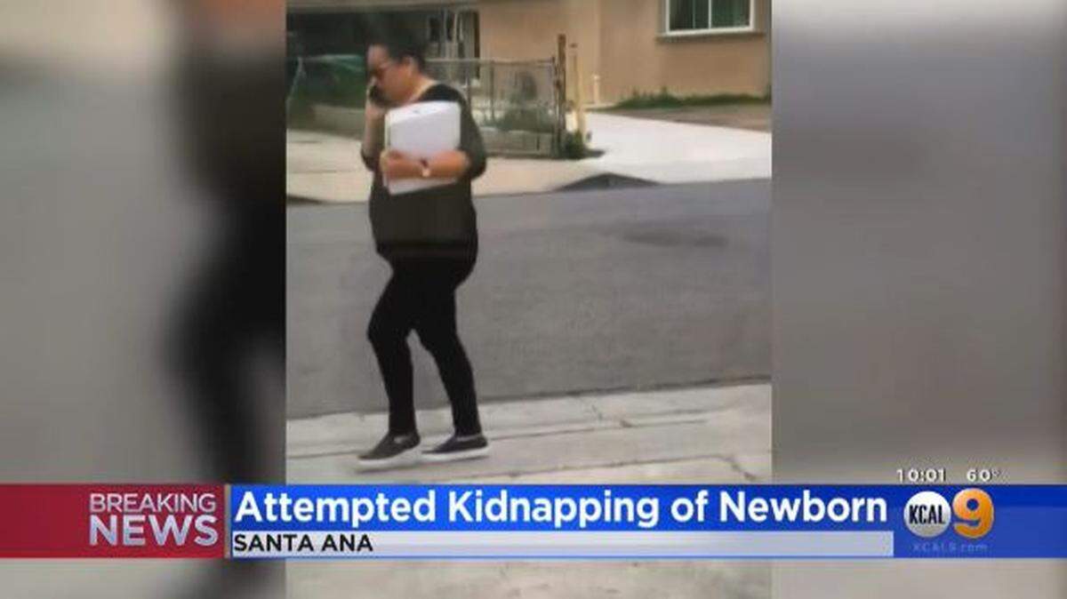 A 38-year-old woman accused of trying to take a newborn baby by telling the mom she was a social worker turned herself in, police in Santa Ana, California, say. The mother refused to give up her child.