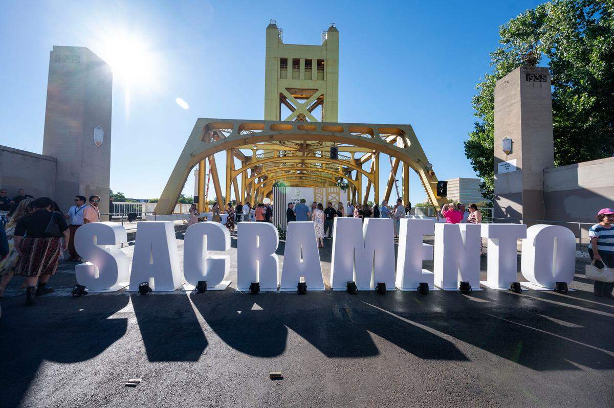 A Sacramento sign leads guests to the Farm-to-Fork Festival’s Tower Bridge Dinner on Sunday.