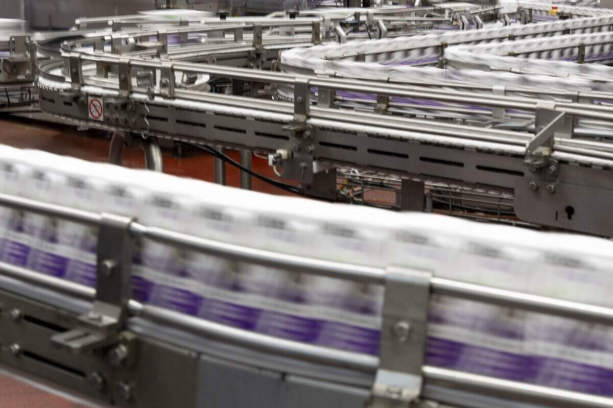 Juice boxes move through the production line at the Redwood Beverage Group plant in West Sacramento on Thursday.