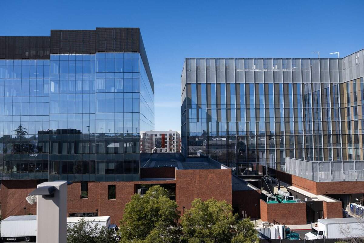300 Aggie Square, left, and 200 Aggie Square, right, the first two buildings of the Aggie Square project, are nearing completion on Thursday, Feb. 20, 2025. 