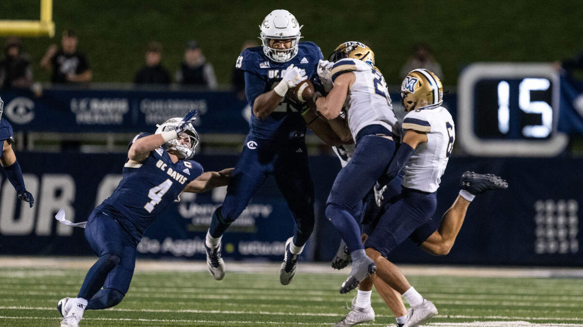 UC Davis Aggies tight end Winston Williams (23) recovers an onside kick against the Montana State Bobcats in the fourth quarter on Saturday as his attempts a late comeback. 