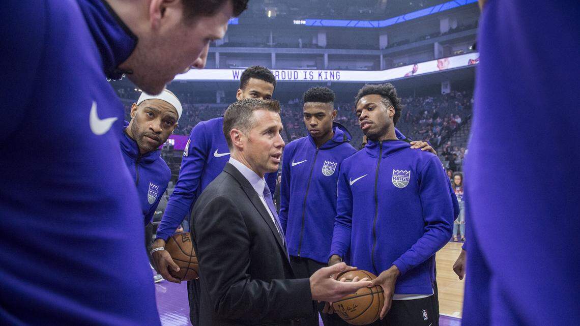 Kings coach Dave Joerger updates players about the protest for Stephon Clark outside Golden 1 Center before Tuesday’s game against the Dallas Mavericks in Sacramento.