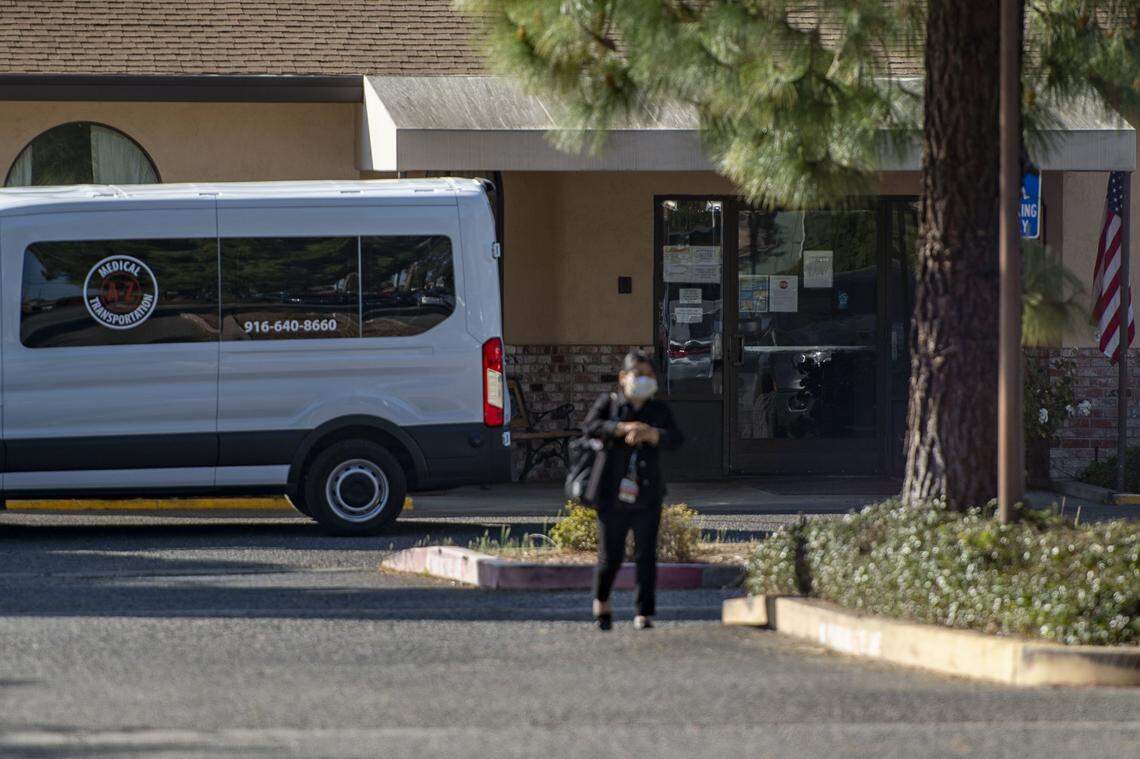 A woman wearing a medical mask walks from Saint Claire’s Nursing Center in south Sacramento on Friday, March 13, 2020. The center has a consistent history as one of the most troubled nursing homes in the state.