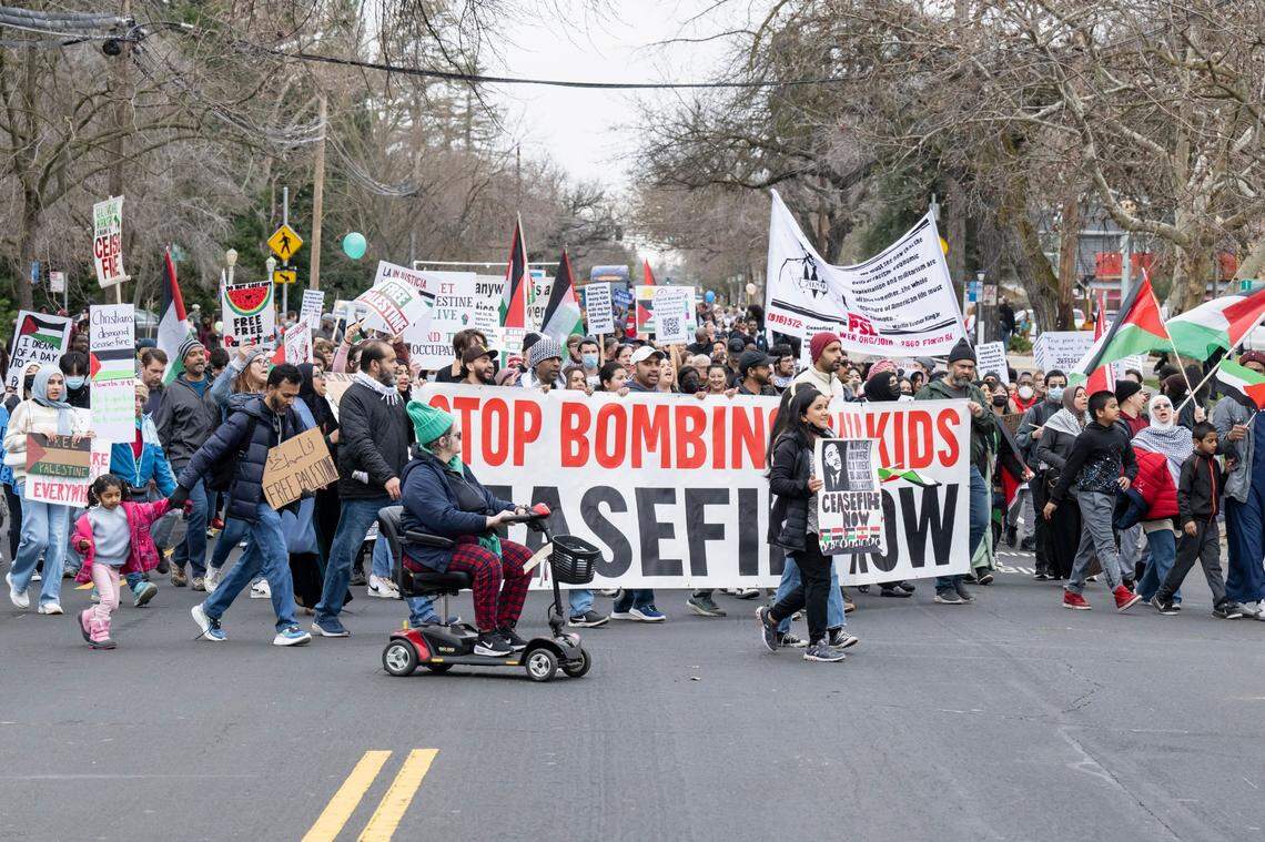 A group with signs calling for a ceasefire in Gaza participates in the MLK365 March for the Dream honoring Martin Luther King Jr. on Monday near Sacramento City College.