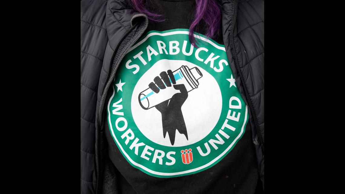 Annmarie Norris leaves her jacket open to show off her "Starbucks Workers United" shirt as she and other Starbucks workers join a national strike Thursday, Nov. 17, 2022, in downtown Columbus, Ohio. 

Ap Starbucks Strikes F Usa Oh