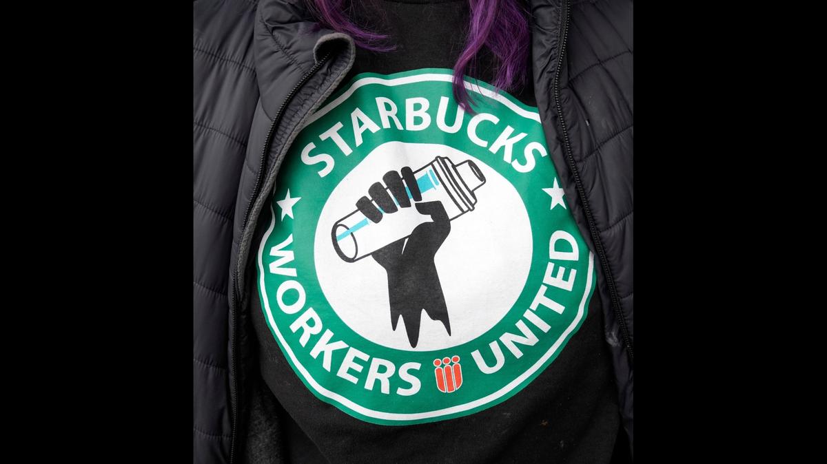 Annmarie Norris leaves her jacket open to show off her "Starbucks Workers United" shirt as she and other Starbucks workers join a national strike Thursday, Nov. 17, 2022, in downtown Columbus, Ohio. 

Ap Starbucks Strikes F Usa Oh