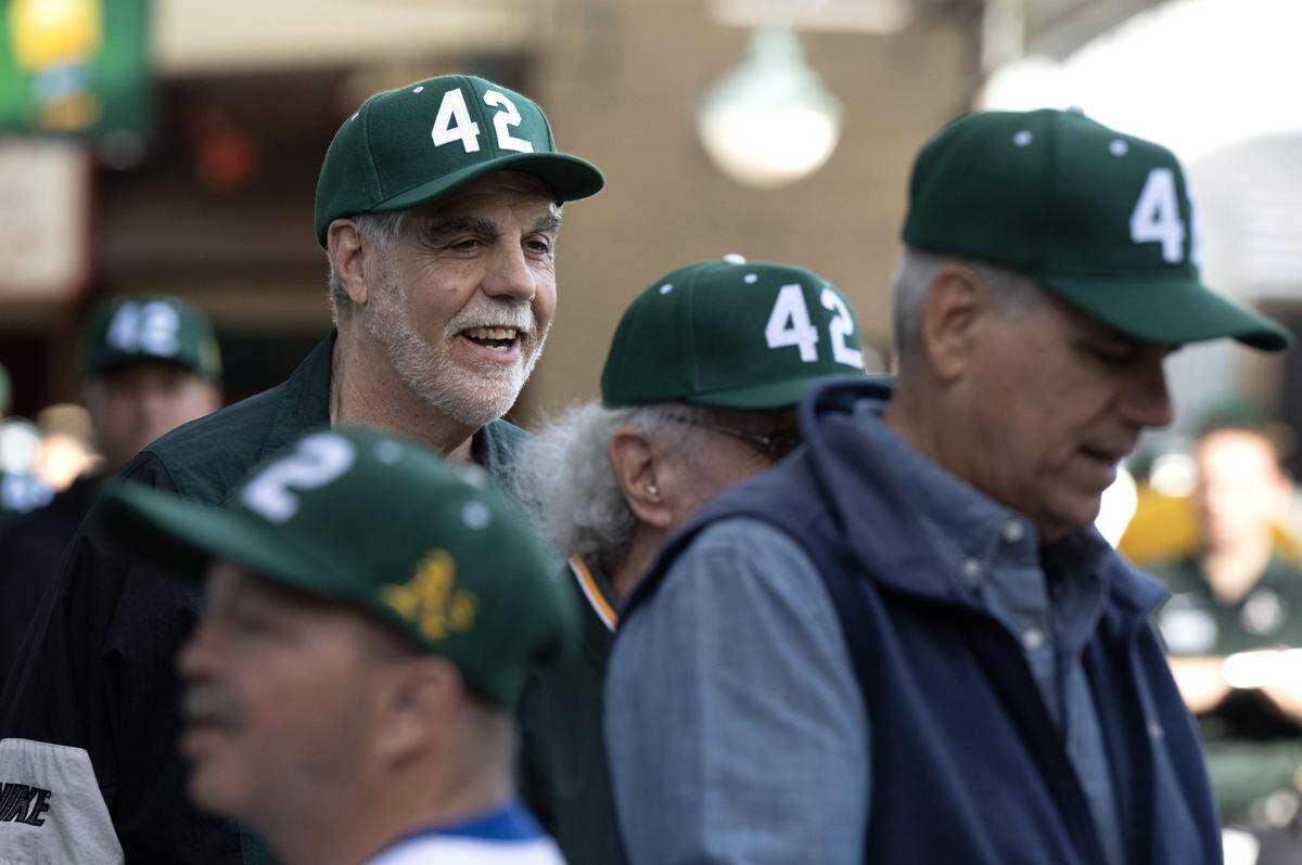 John Abomo dons a No. 42 cap on Jackie Robinson Day before the Athletics played the Texas Rangers at Sutter Health Park on Wednesday in West Sacramento.