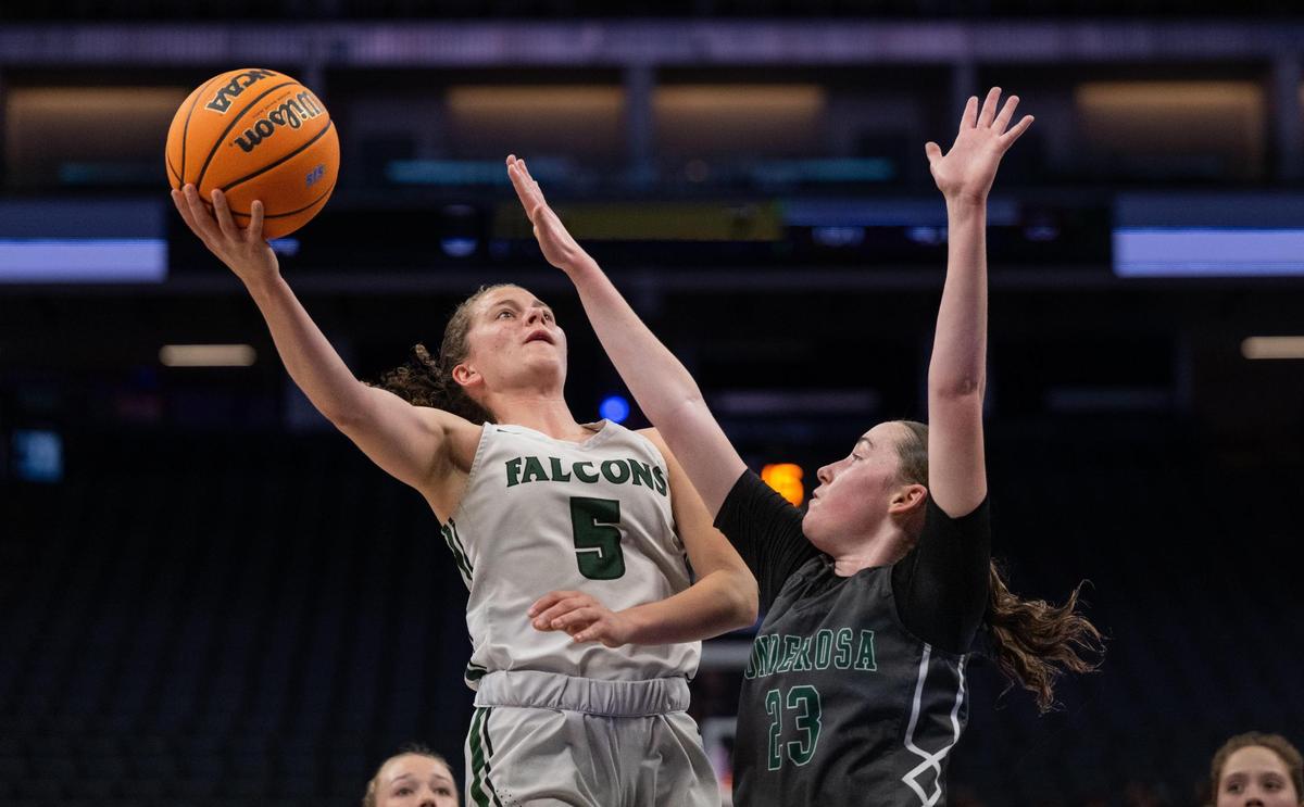 Colfax Falcons guard Kaia Diederichs (5) drives to the basket against Ponderosa Bruins’ Rowan Thomas (23) during a CIF Sac-Joaquin Section Division III girls basketball championship game at Golden 1 Center on Friday.