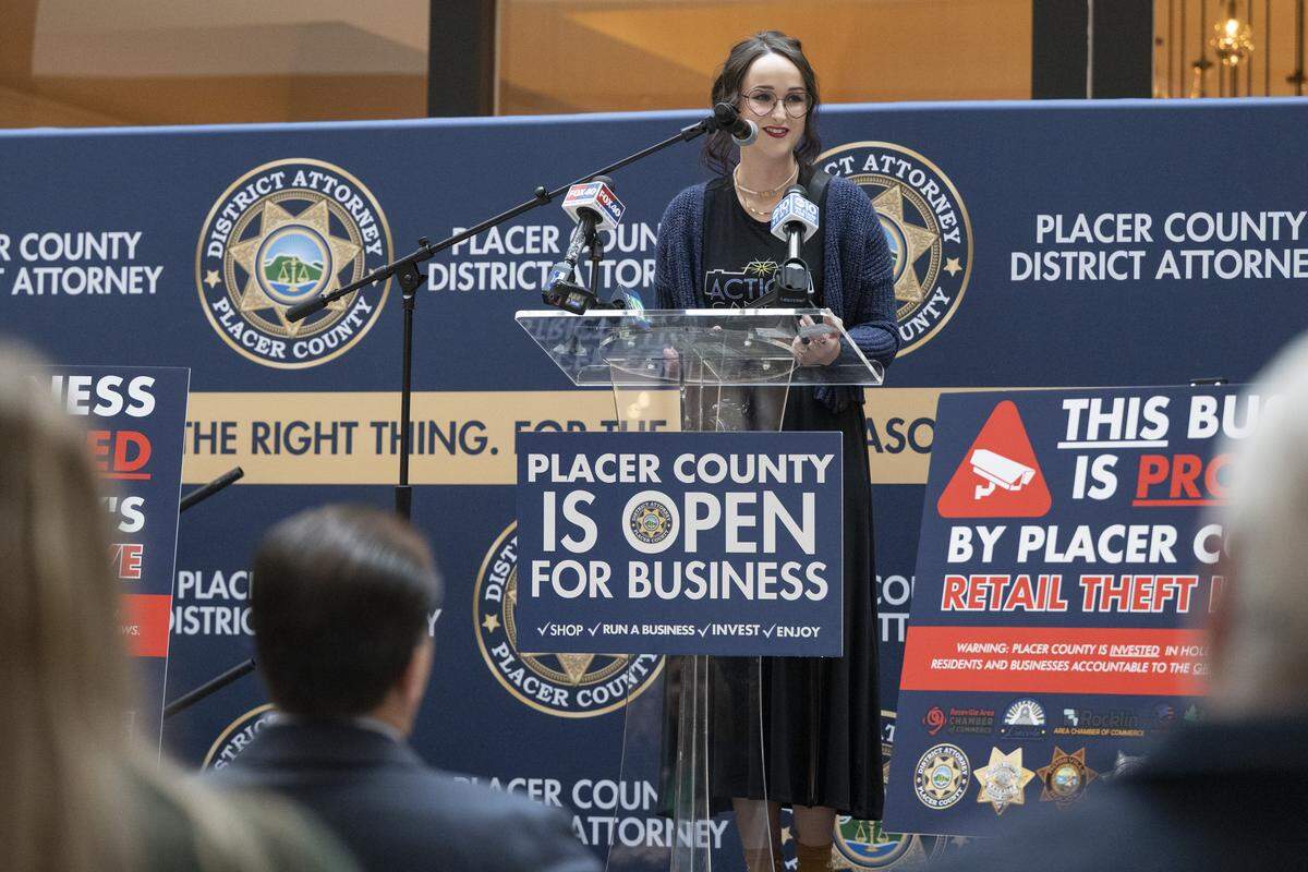 Ellie Doyen, community and media manager for Action Camera store in Rocklin, speaks Wednesday during a news conference on preventing and solving retail theft at the Roseville Galleria. Her store was burglarized earlier in the year.