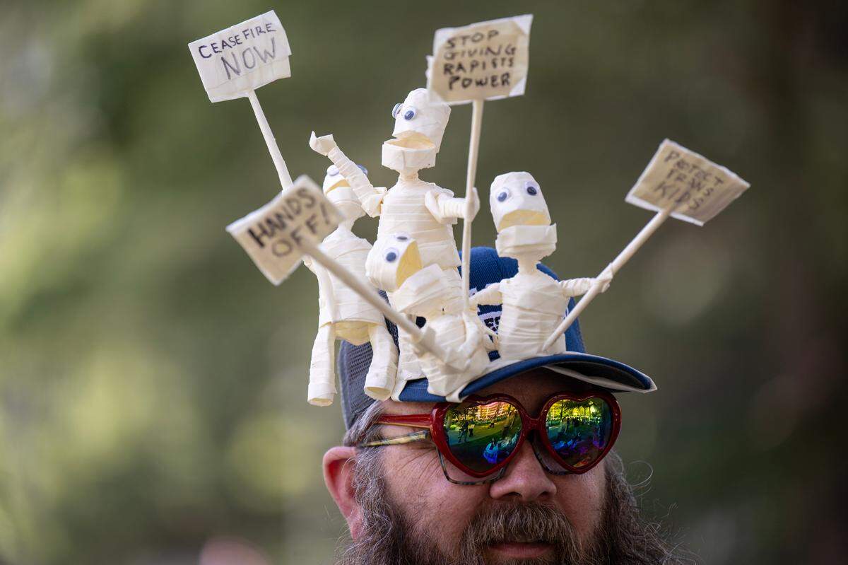Sacramento resident Eben Burgoon of uses creative tape characters to make a statement during the 50501 protest against the Trump administration at the state Capitol on Saturday.