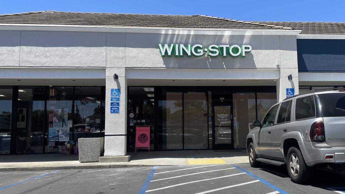 A parking lot view of an incoming Wing Stop, fast-casual chain restuarant, located at 8694 Elk Grove Boulevard, suite 3, next to Charlene’s Beauty Supply.
