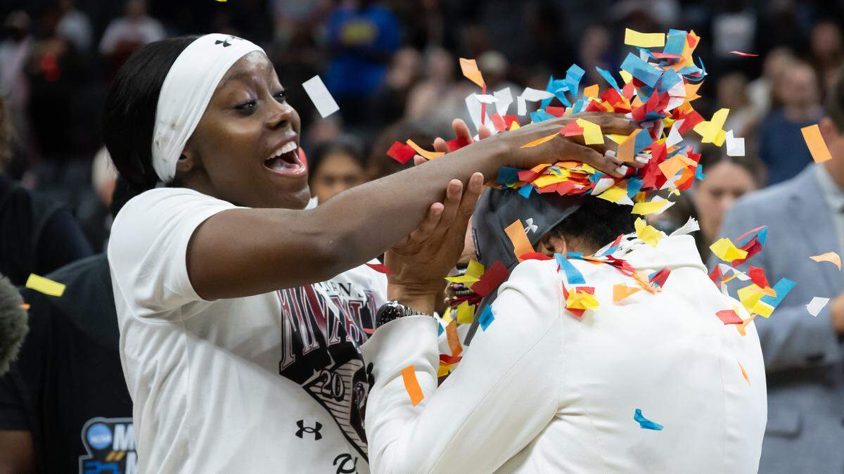 South Carolina Gamecocks guard Raven Johnson (25) dumps confetti on head coach Dawn Staley after their team beat the Texas Christian University Horned Frogs 78-52 during the NCAA Women’s Basketball Tournament Sweet 16 at Golden 1 Center in Sacramento on Monday, March 30, 2026.