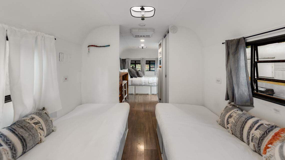 The tiny homes have modern kitchens, farmhouse sinks, private patio spaces and views.