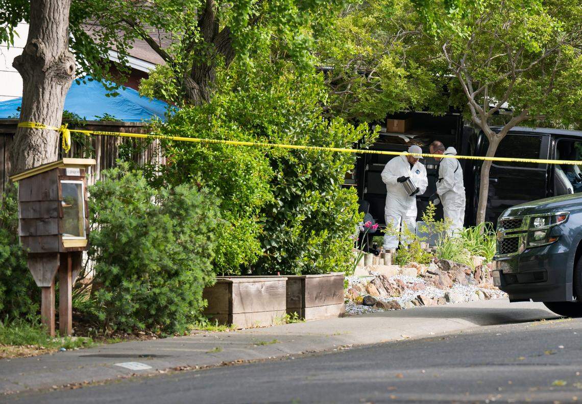Investigators process items at the home Davis stabbing suspect Carlos Reales Dominguez shared with roommates on Hawthorn Lane, seen from West Eighth Street, on Thursday, May 4, 2023, after Davis police Chief Darren Pytel announced his arrest for three recent stabbings in the city.