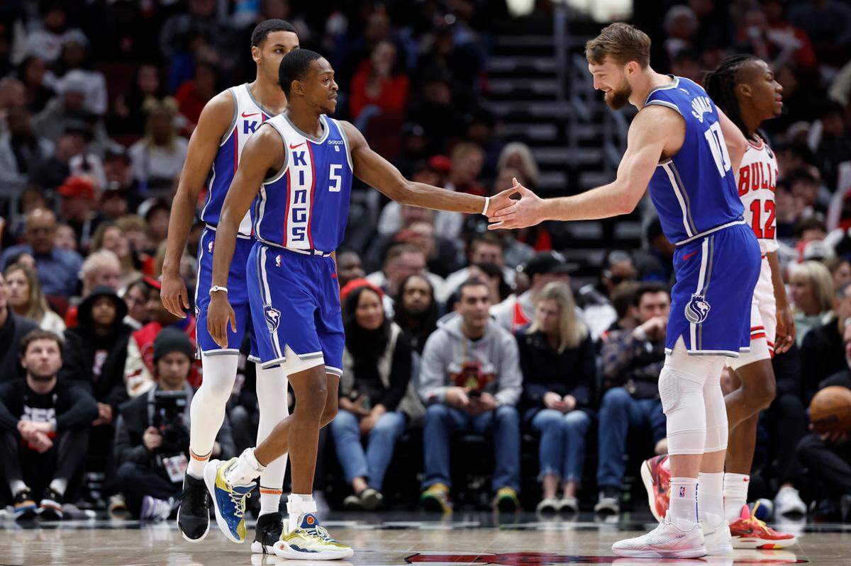 Sacramento Kings guard De’Aaron Fox (5) celebrates with center Domantas Sabonis (10) after scoring against the Chicago Bulls during the first half Saturday, Feb. 3, 2024, at United Center in Chicago, Illinois.