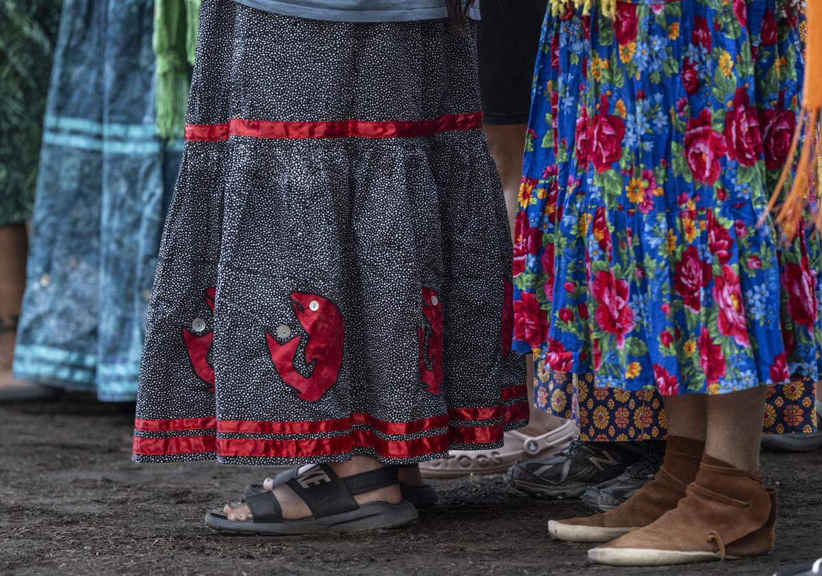Members of the Winnemem Wintu tribe stand as they welcome a congregation of Maori people from New Zealand in Siskiyou County in August. The tribes have been collaborating to reintroduce New Zealand salmon to their ancestral habitat on the McCloud River near Mount Shasta.  