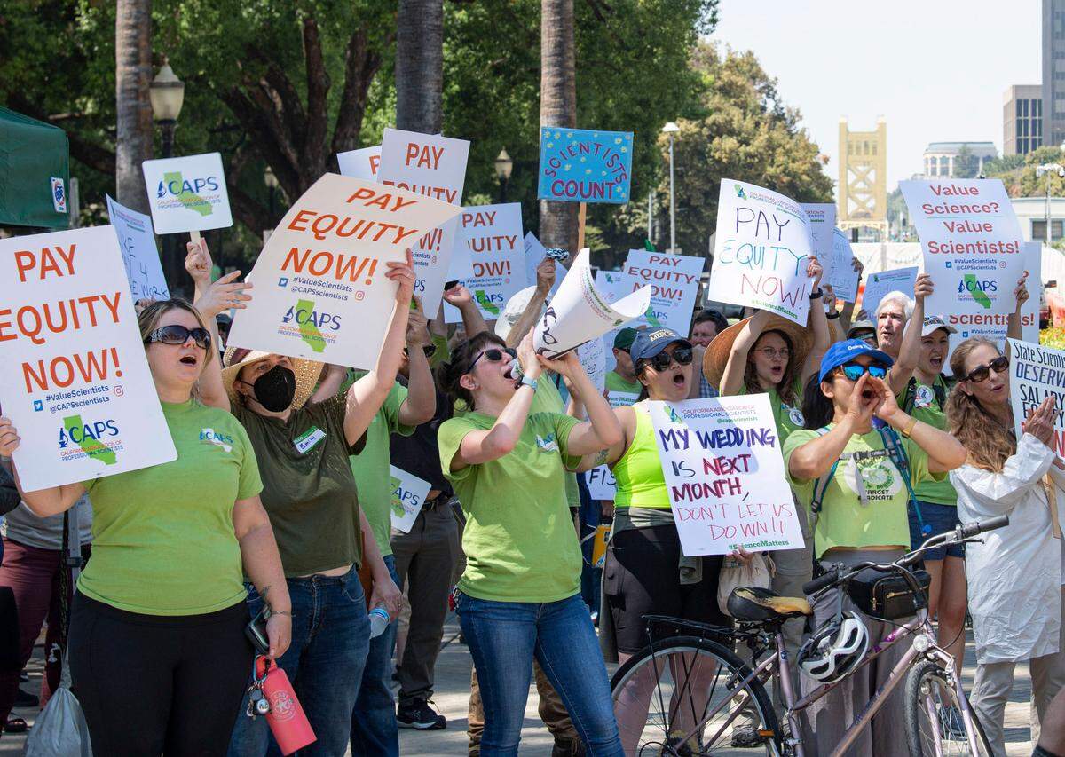 Members of the California Association of Professional Scientists rally for increased wages at the Capitol on Aug. 30. The union represents 5,300 scientists that work for the state of California. Its labor agreement expired in 2020, and the group maintains that salaries for its workers have lagged behind managers, supervisors and state engineers by 30%.