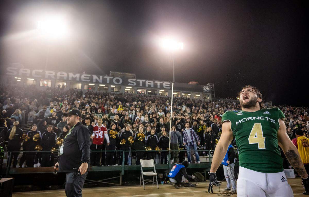 Sacramento State running back Cameron Skattebo (4) cheers on the Hornets defense with the home crowd as they play in the final minutes against Incarnate Word (Texas) at the NCAA college football FCS playoffs quarterfinal game in 2022 at Hornet Stadium in Sacramento. Skattebo is projected to be selected in the 2025 NFL draft.