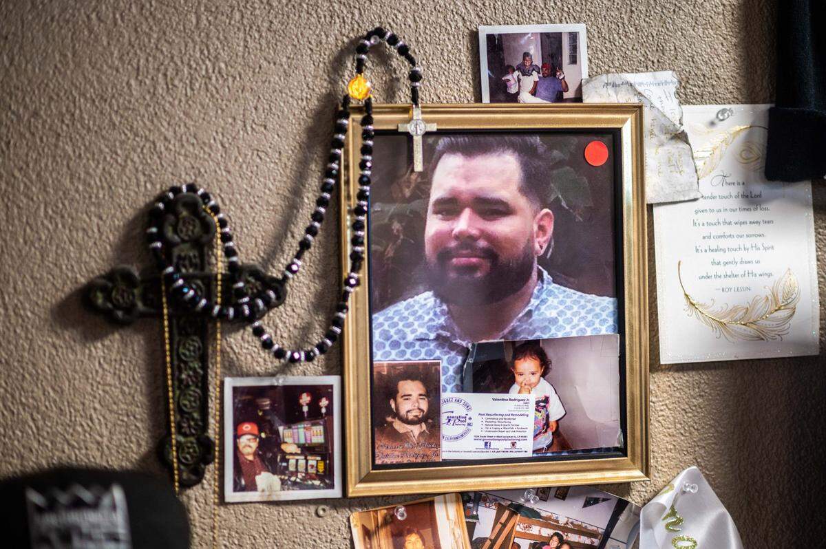 A picture of Valentino Rodriguez Jr. hangs next to a rosary in his father’s office at Generation Pool Plastering in West Sacramento on Tuesday, April 6, 2021. Rodriguez Jr., a correctional officer who left his job at California State Prison-Sacramento in Folsom after suffering harassment, was found dead at home in October.