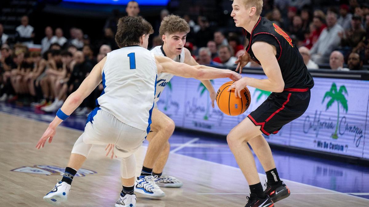The Rocklin Thunder’s Connor Delaby (1) steals the ball from the Jesuit Marauders’ Luke Browne (10) in the final seconds of the game, leading to a Rocklin basket and win in the CIF Sac-Joaquin Section Division ll championship at Golden 1 Center on Thursday.