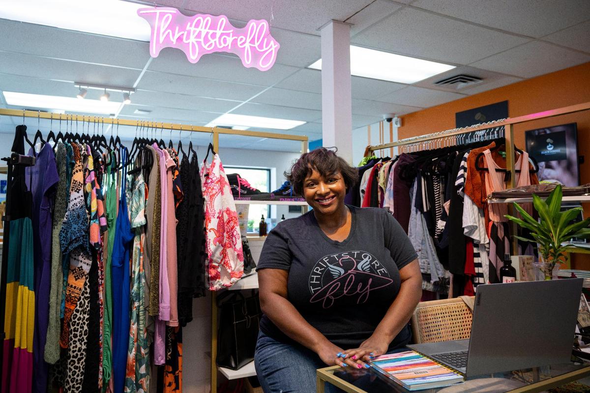 Thriftstorefly owner Mersadez Hogan sits with her merchandise on Aug. 3 at CLTRE Club, a Sacramento venue that helps new business owners establish a brick-and-mortar location.