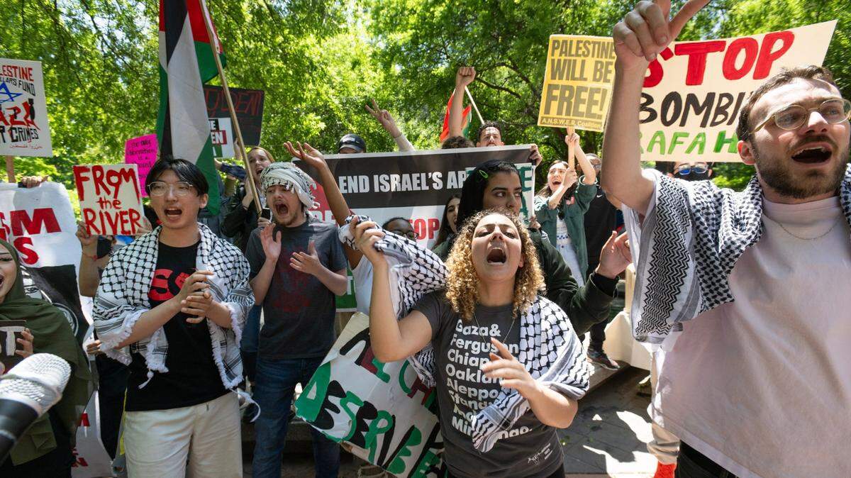 Members of the Sacramento State chapter of Students for Justice Palestine chant after a campus press conference on Wednesday, May 8, 2024, about university’s agreement to alter its investment policy language. The group has been camped out on the quad since late last month, calling for disclosure of any university ties to Israel and divestment if such ties exist.