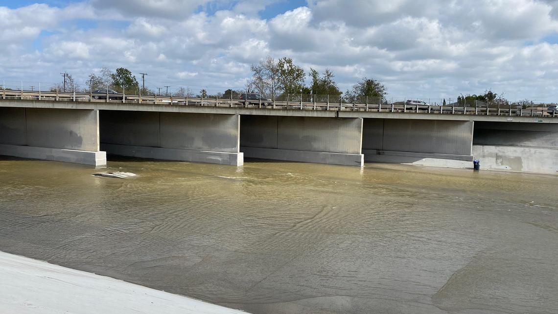 A boy was rescued by a bystander after he was swept away in a California river bed, fire officials said.