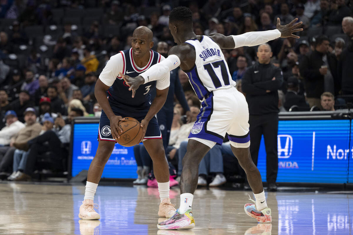 LA Clippers guard Chris Paul (3) is guarded by Sacramento Kings guard Dennis Schröder (17) during a game between the Kings and the Clippers at Golden 1 Center in Sacramento on Wednesday, Oct. 15, 2025.