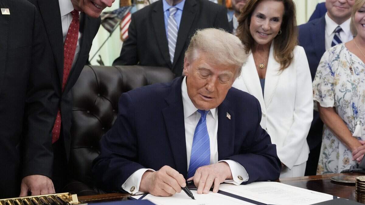 US President Donald Trump signs the "Secure America Act" in the Oval Office of the White House in Washington, DC, on June 10, 2026. The bill provides around $38 billion for Immigration and Customs Enforcement (ICE), $26 billion for Border Patrol and another $5 billion for unforeseen costs, effectively ensuring a steady flow of money for Trump's deportation agenda through fiscal 2029. (Photo by Ken Cedeno / AFP via Getty Images)