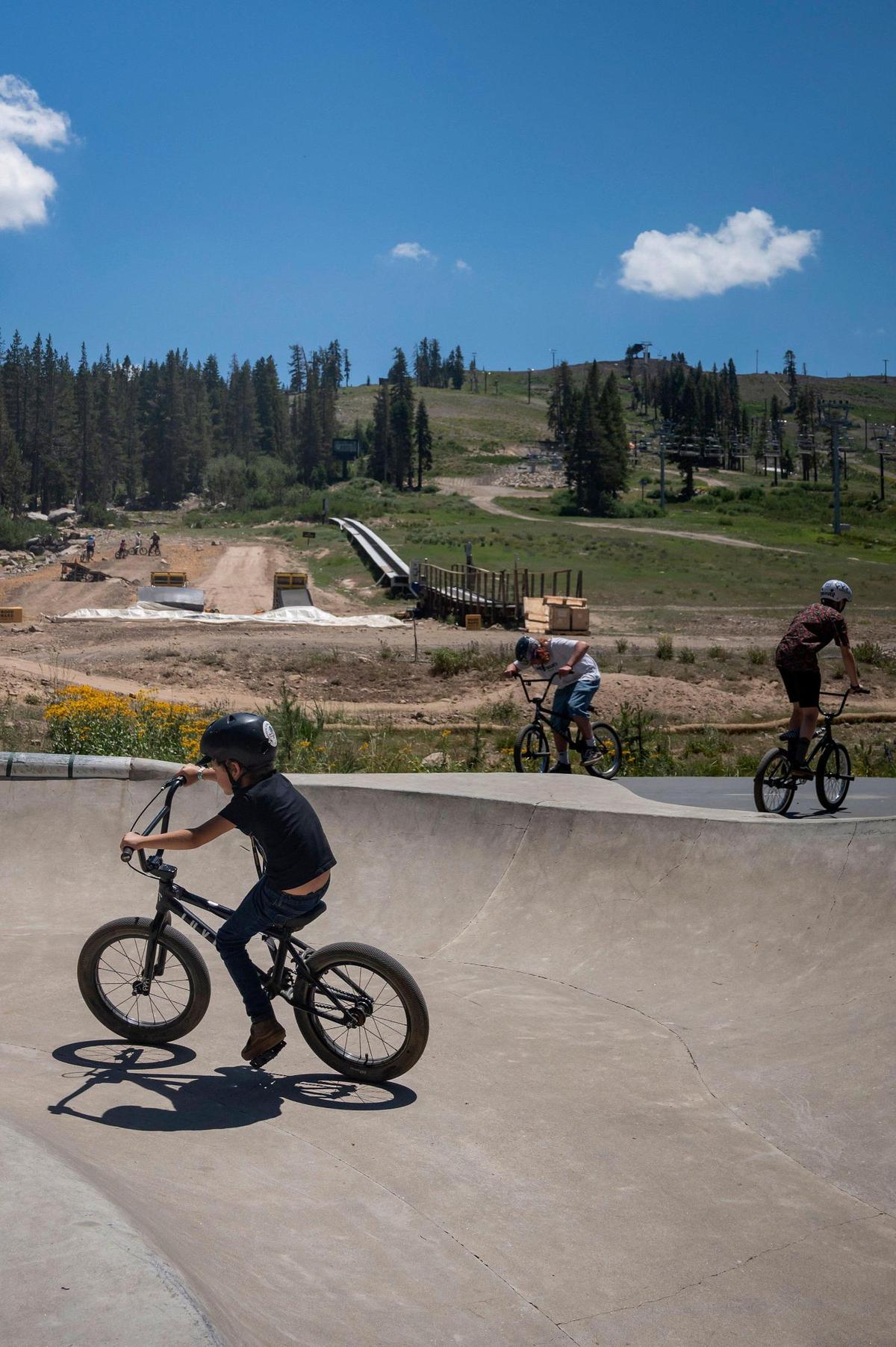 Frey Mitchell, 7, of Reno, rides his BMX bike around the Evergreen Bowl at Woodward Tahoe summer camp Monday, July 18, 2022, at Boreal Mountain Resort in Soda Springs.